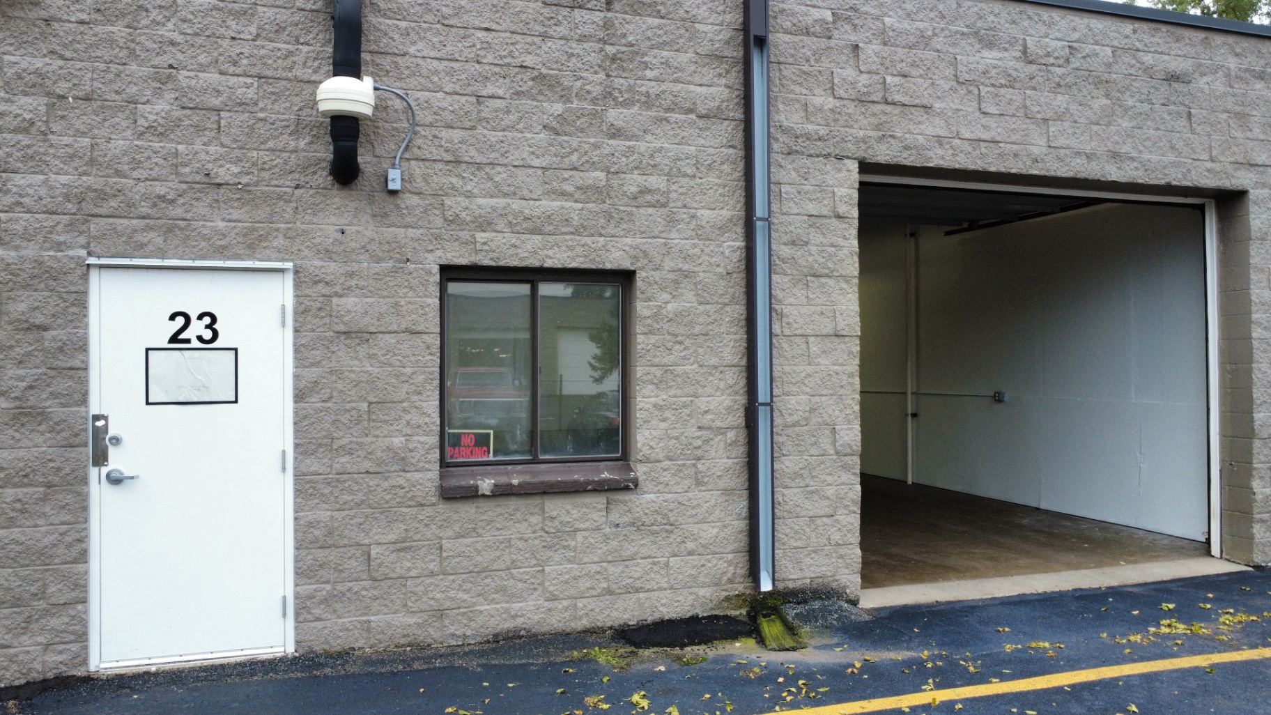 Suite entry and open drive-in door at Welcome Square