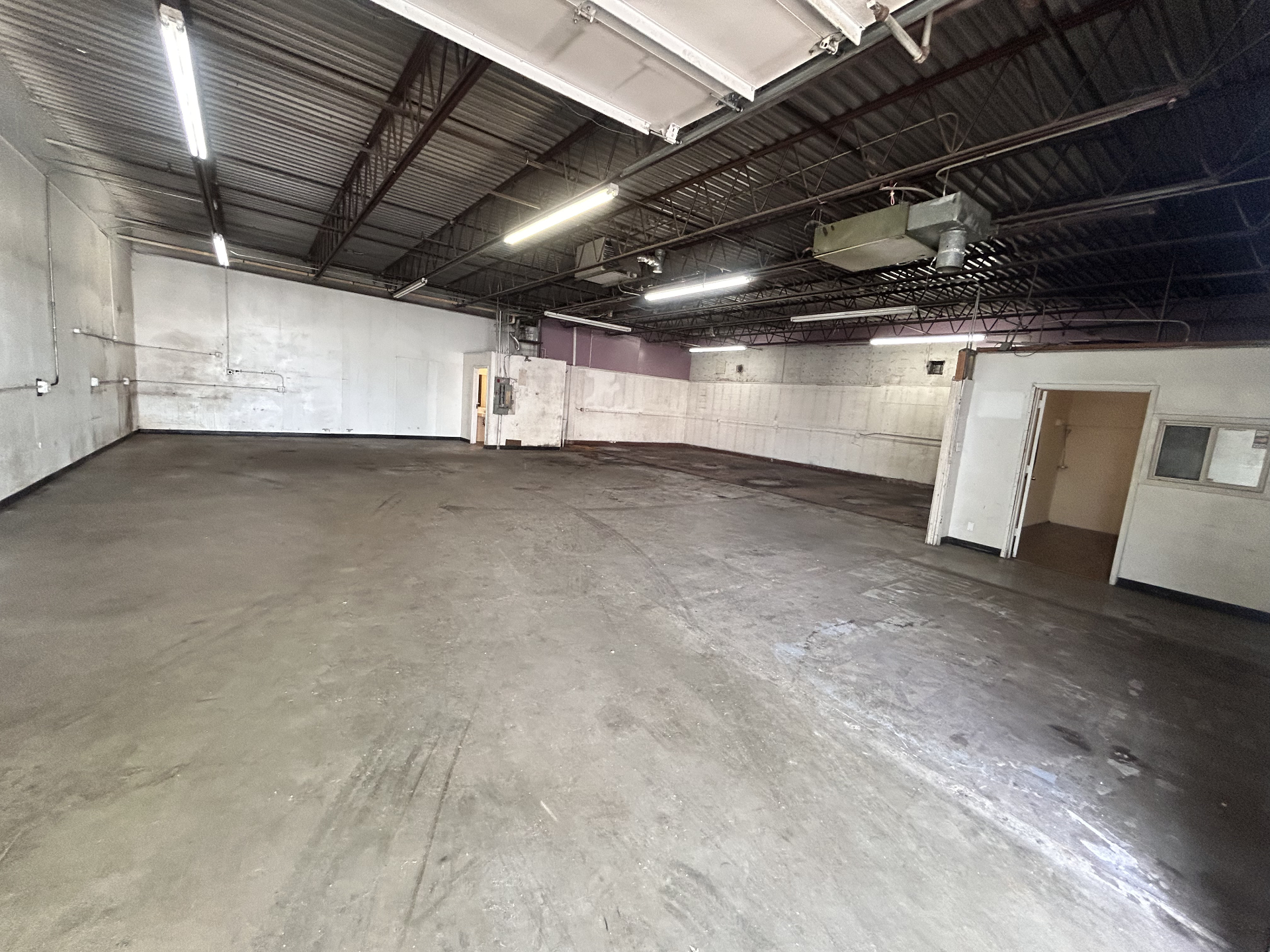 Wide interior view of the warehouse with high ceilings
